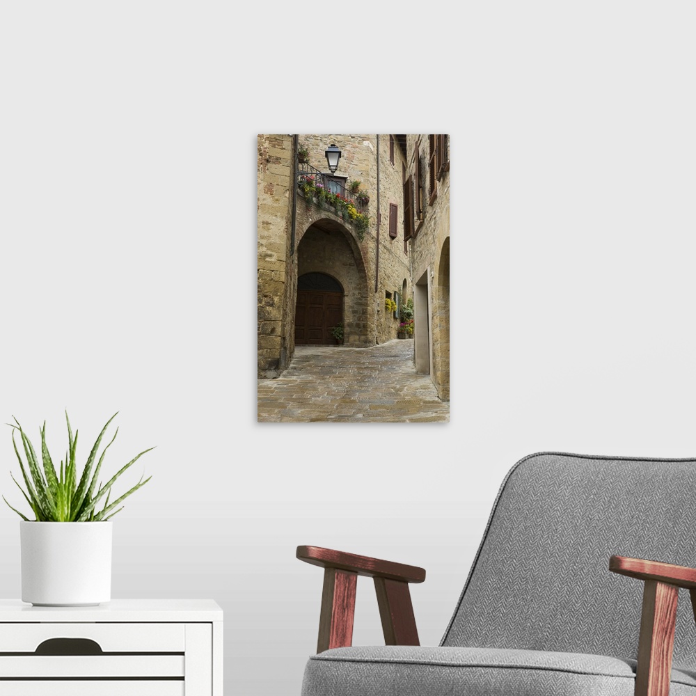 A modern room featuring Italy, Montichiello. Houses along a lane in a medieval village.