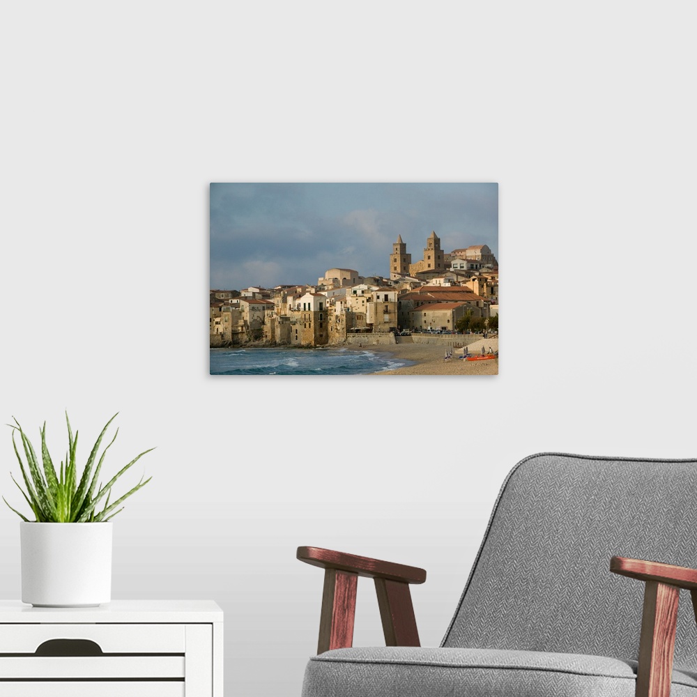 A modern room featuring ITALY-Sicily-CEFALU:.Town View with Duomo from Beach / Sunset... Walter Bibikow 2005