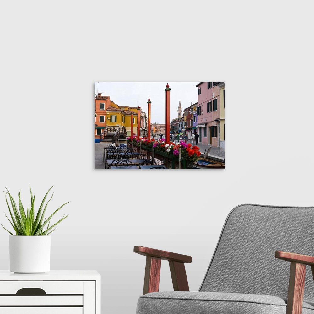 A modern room featuring Italy, Venice, Burano. Cafe tables along the canal.