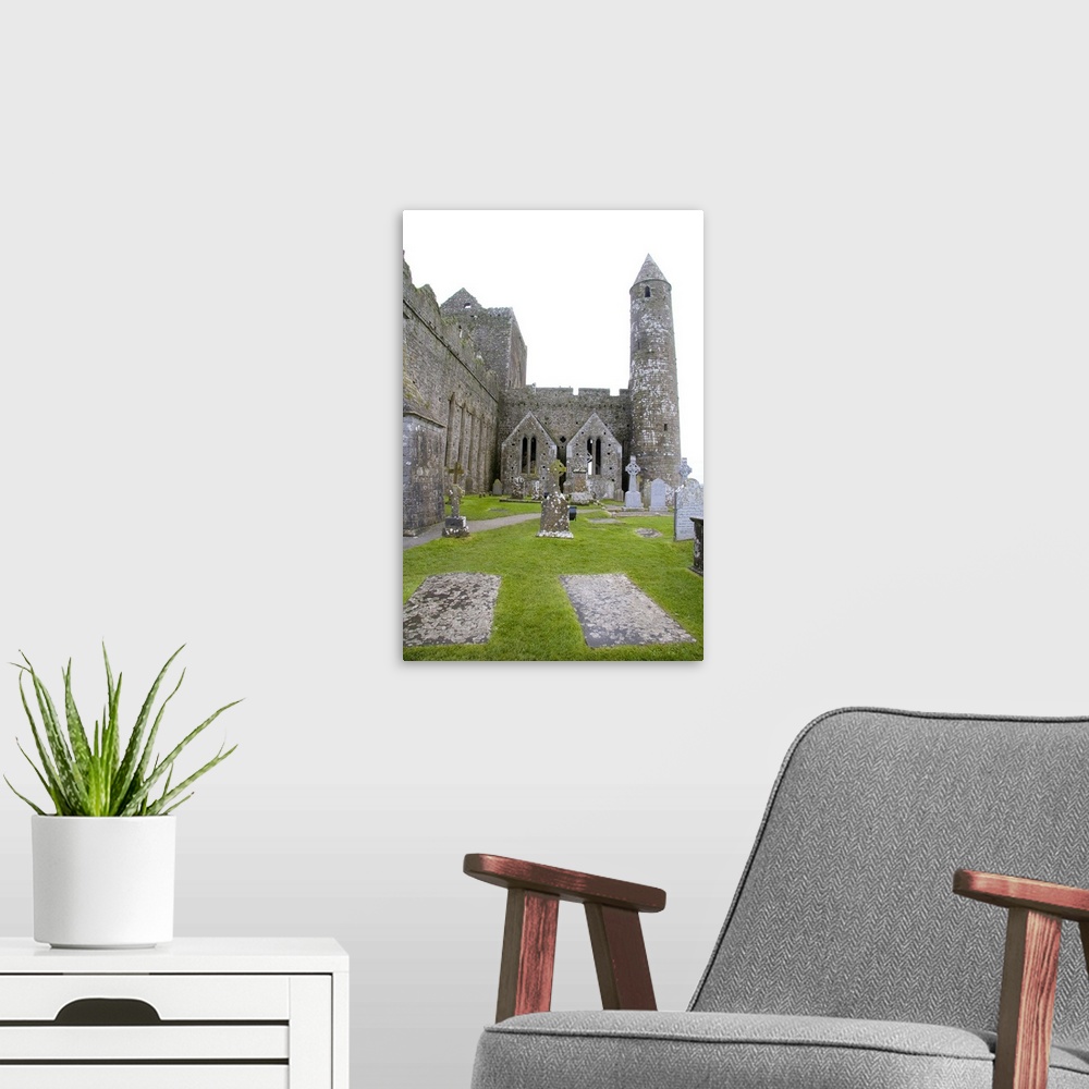 A modern room featuring Killkenny, Ireland. The dramatic Spectacle of the Rock of Cashel and it's gravesites.