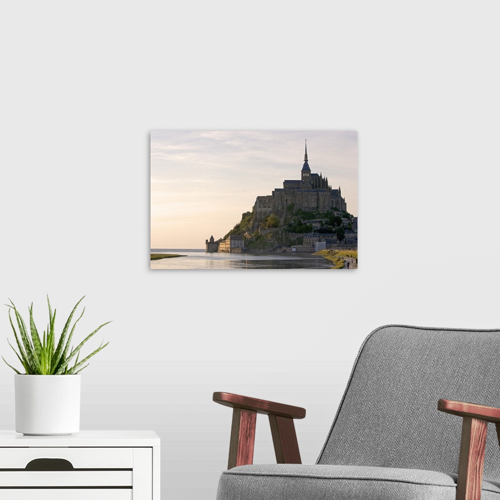 A modern room featuring Le Mont Saint Michel at sunset in the region of Basse-Normandie, France.