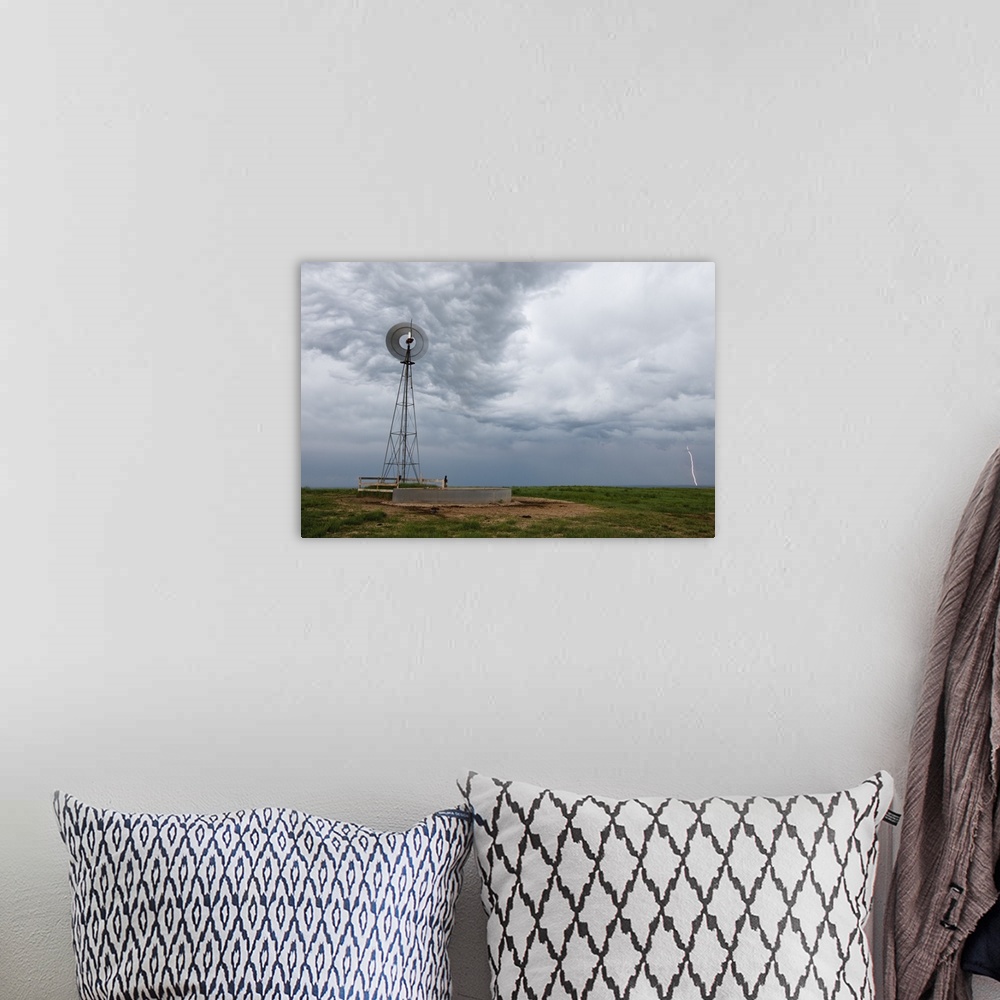 A bohemian room featuring lightning storm and windmill in the Pawnee National Grasslands, eastern Colorado, USA