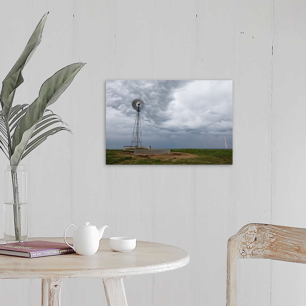 A farmhouse room featuring lightning storm and windmill in the Pawnee National Grasslands, eastern Colorado, USA