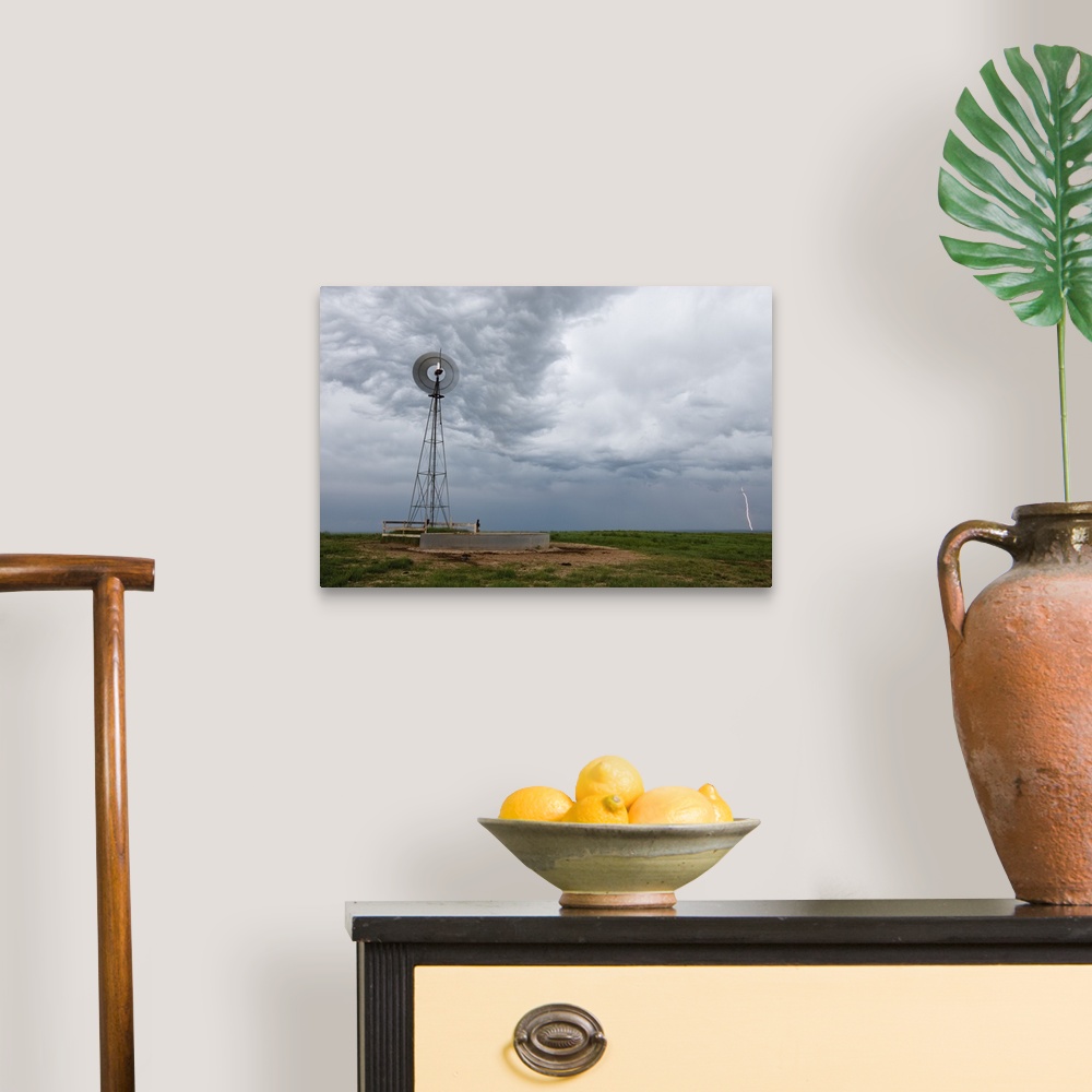 A traditional room featuring lightning storm and windmill in the Pawnee National Grasslands, eastern Colorado, USA