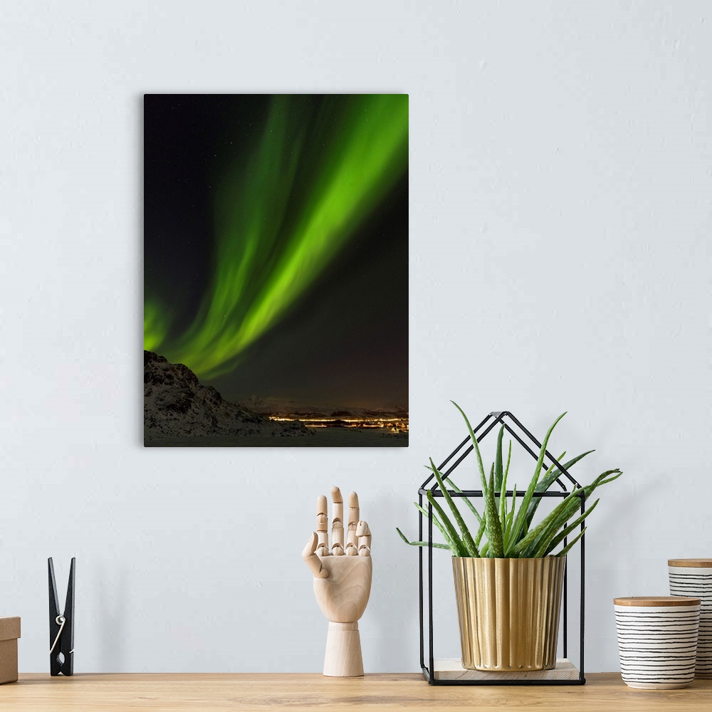 A bohemian room featuring Northern Lights near Leknes, island Vestvagoy. The Lofoten islands in northern Norway during wint...