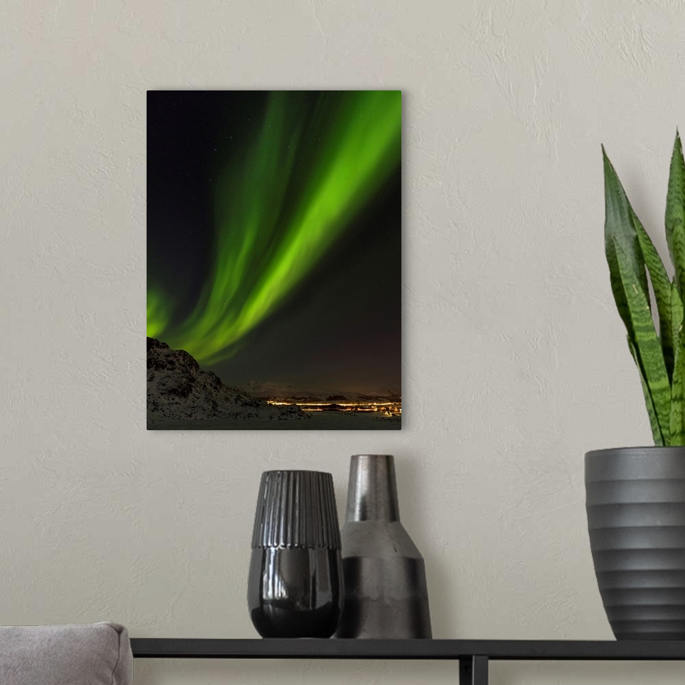 A modern room featuring Northern Lights near Leknes, island Vestvagoy. The Lofoten islands in northern Norway during wint...