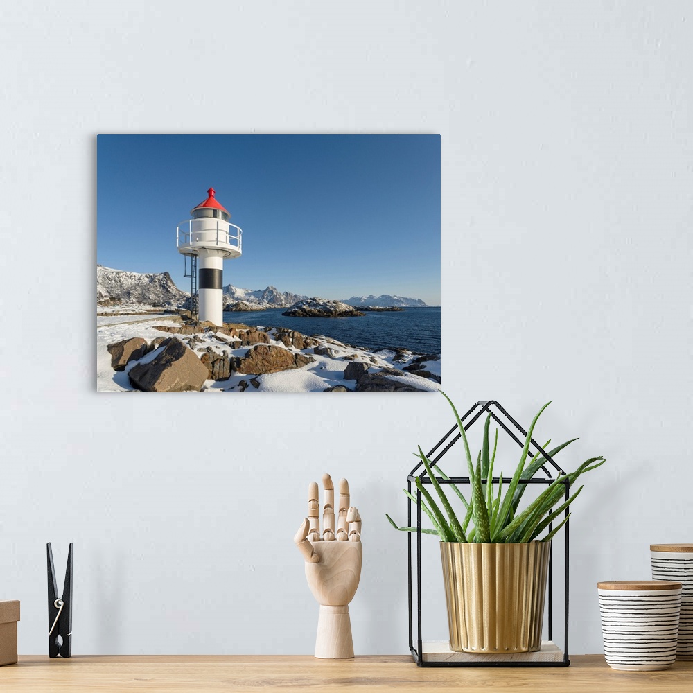 A bohemian room featuring Small town Kabelvag, island Austvagoya. The Lofoten islands in northern Norway during winter. Eur...