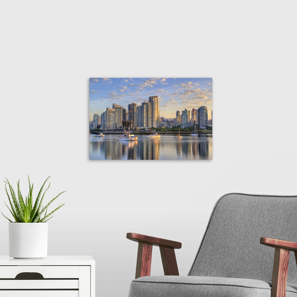 A modern room featuring Looking across False Creek at the skyline of Vancouver British Columbia at sunrise