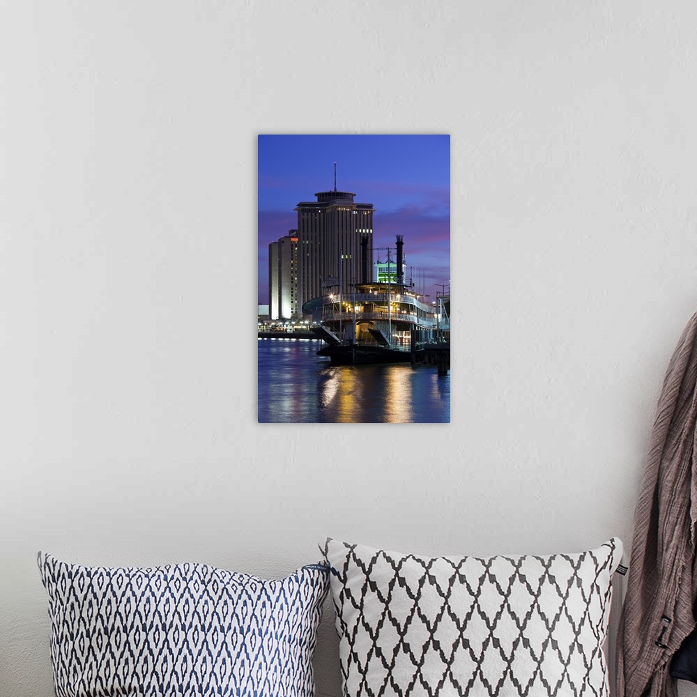 A bohemian room featuring USA, Louisiana, New Orleans. World Trade Center, riverboat and Mississippi Riverfront, dusk.