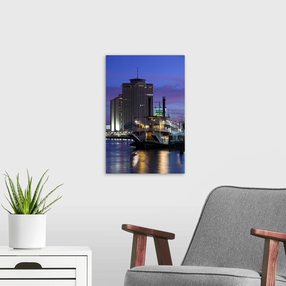 A modern room featuring USA, Louisiana, New Orleans. World Trade Center, riverboat and Mississippi Riverfront, dusk.