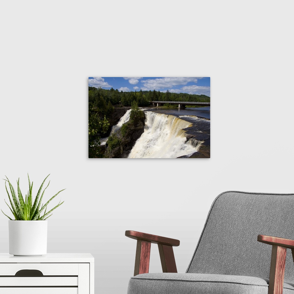 A modern room featuring Beautiful Kakabeka Falls near Thunder Bay Ontario Canada with falls flowing water
