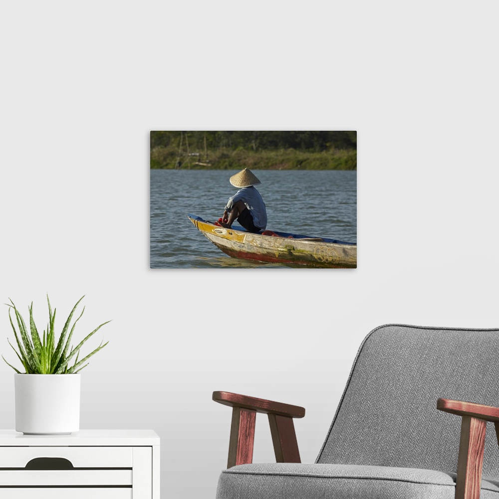 A modern room featuring Man fishing from boat on Thu Bon River, Hoi An (UNESCO World Heritage Site), Vietnam