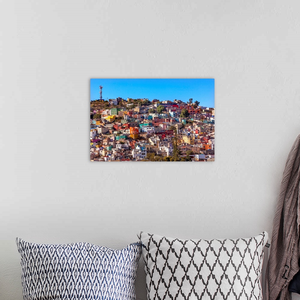 A bohemian room featuring Many Colored Orange Blue Red Houses of Guanajuato Mexico.