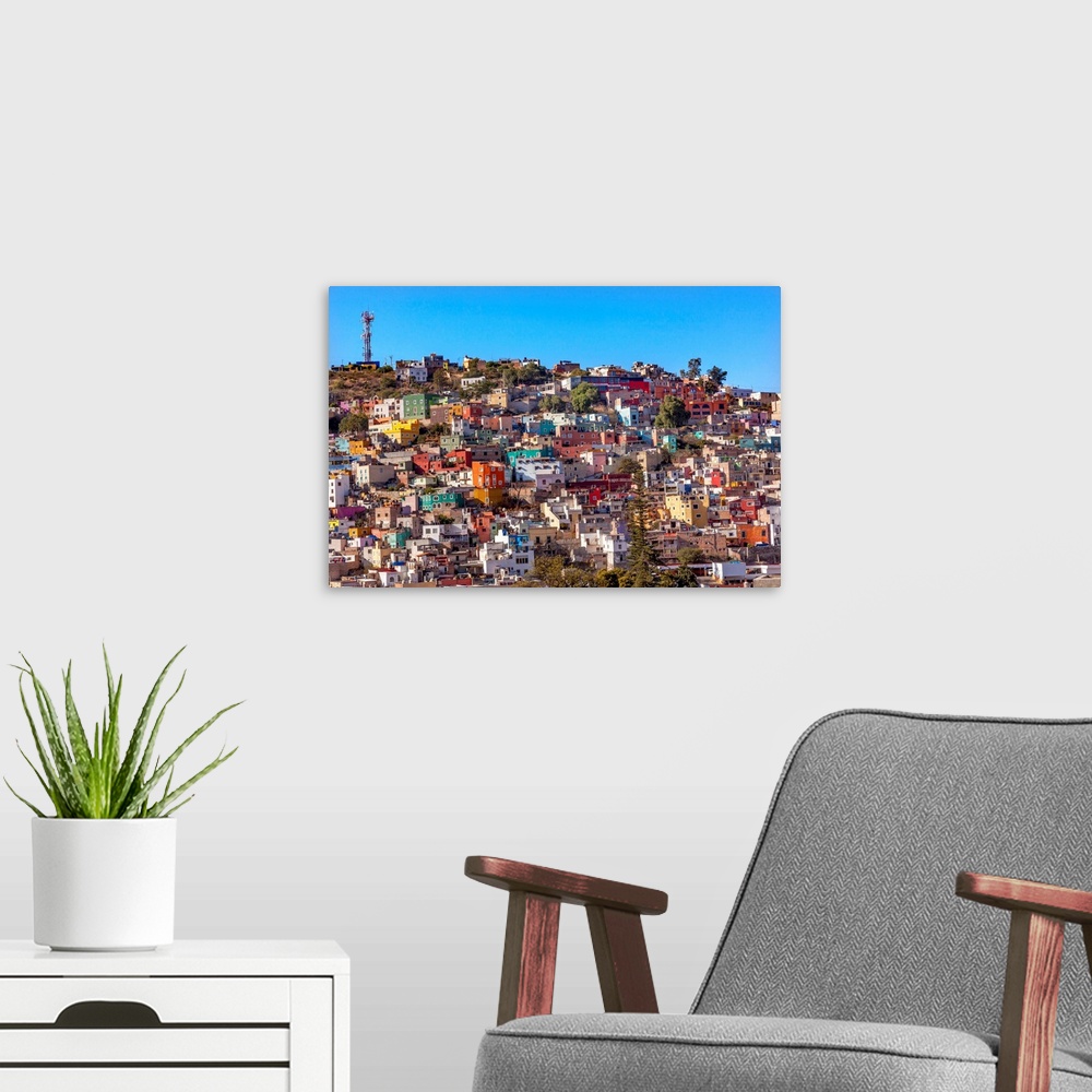 A modern room featuring Many Colored Orange Blue Red Houses of Guanajuato Mexico.