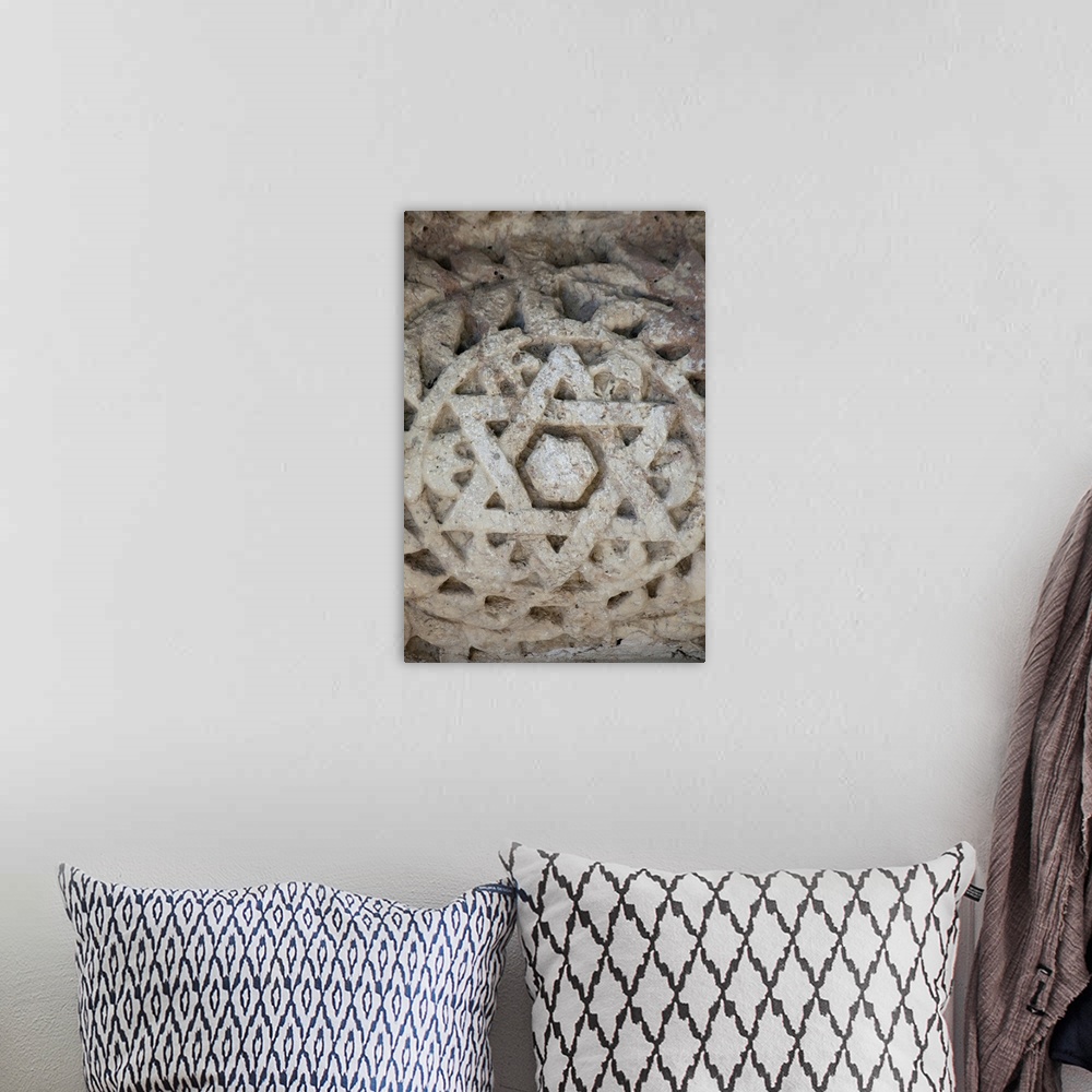 A bohemian room featuring Marble Star of David at ancient Jewish temple in Capernaum, Israel.
