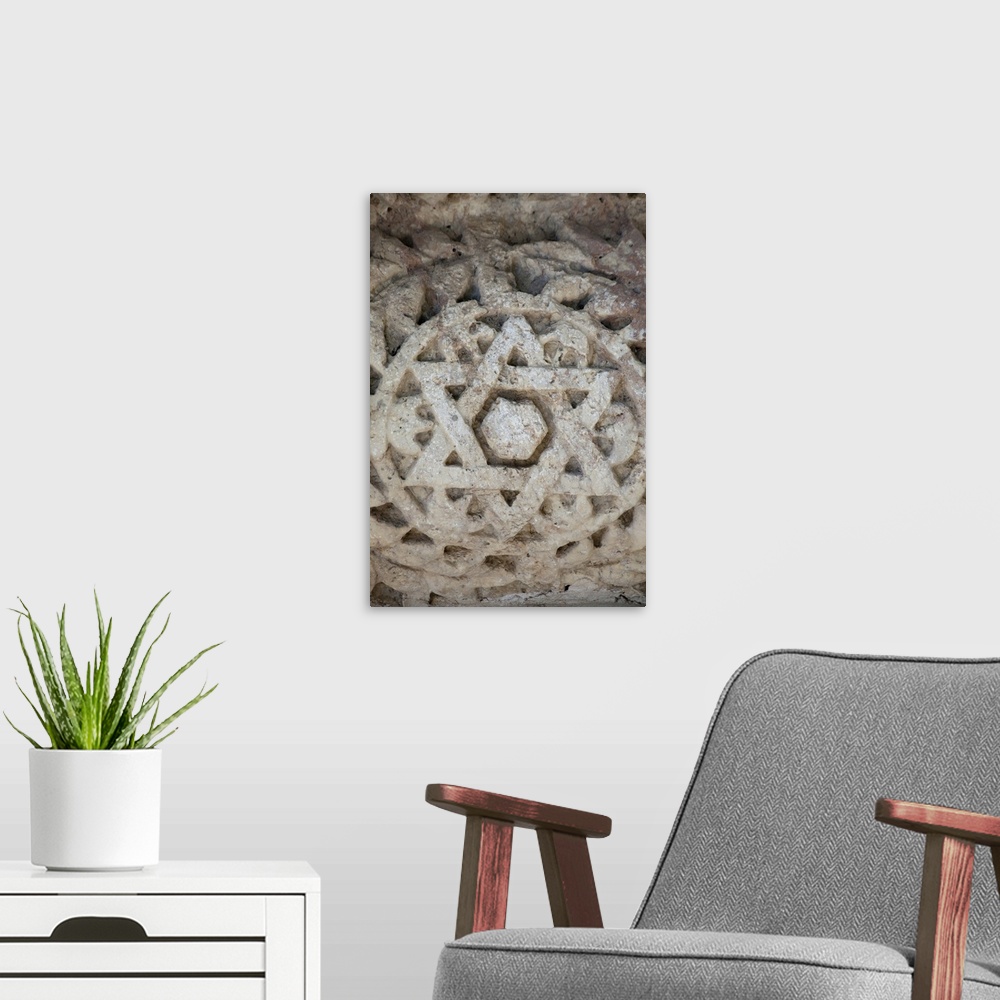 A modern room featuring Marble Star of David at ancient Jewish temple in Capernaum, Israel.