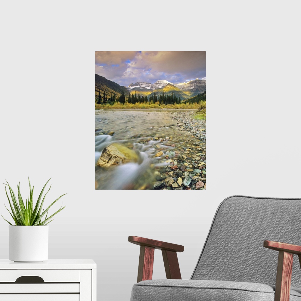 A modern room featuring McDonald Creek with the Garden Wall in autumn in Glacier National Park, Montana, USA