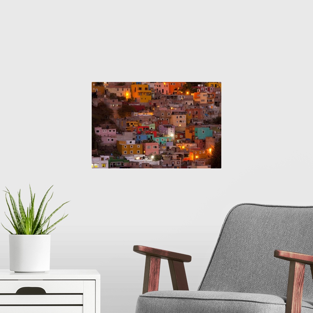 A modern room featuring North America, Mexico, Guanajuato. The colorful homes and buidings of Guanajuato at night