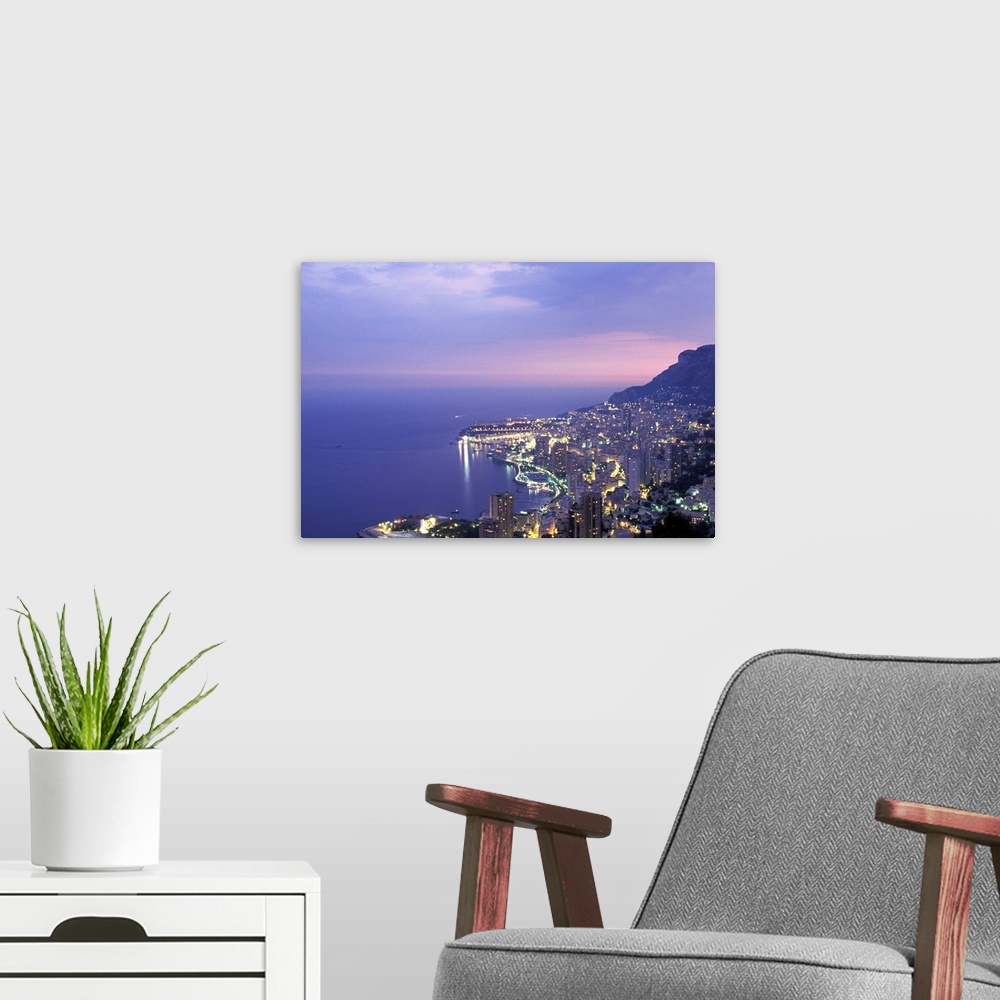 A modern room featuring Monaco. Cote d'Azur. Montecarlo at dusk.