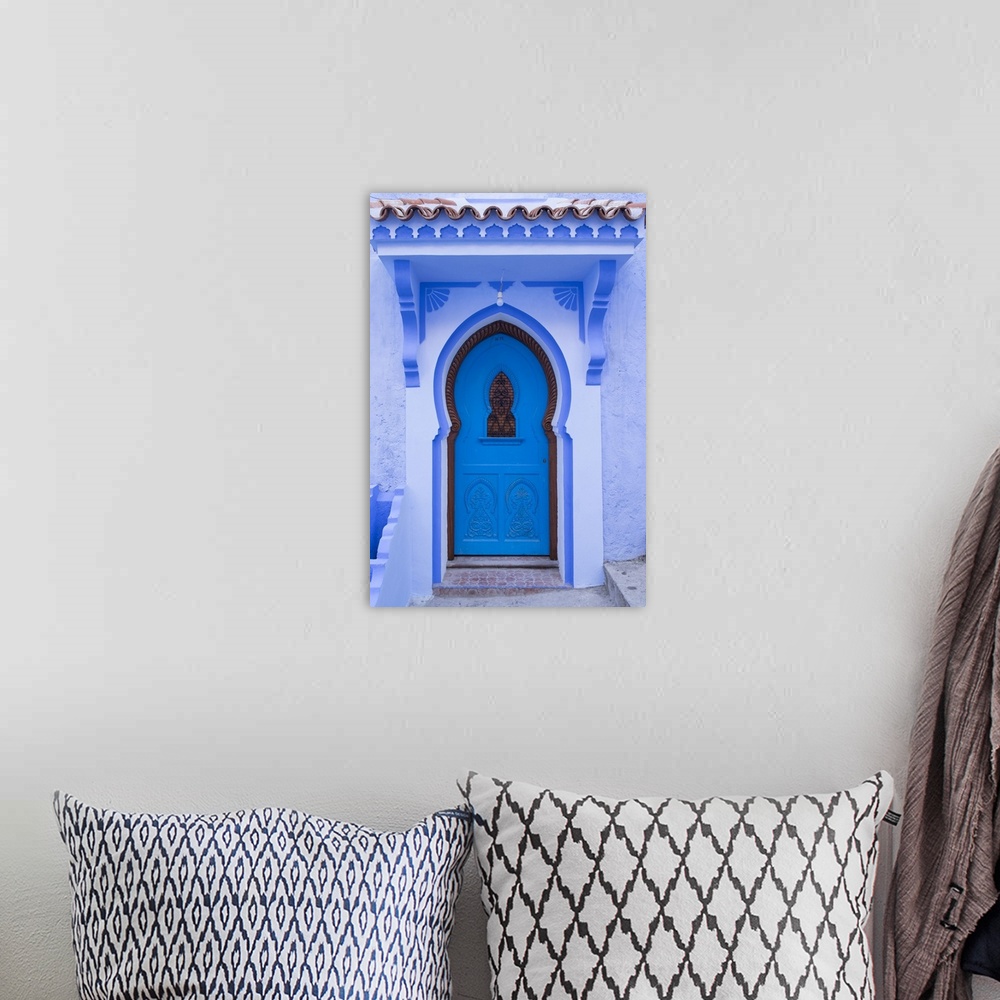 A bohemian room featuring Morocco, Chefchaouen. A traditional door and entrance to a home in the village.