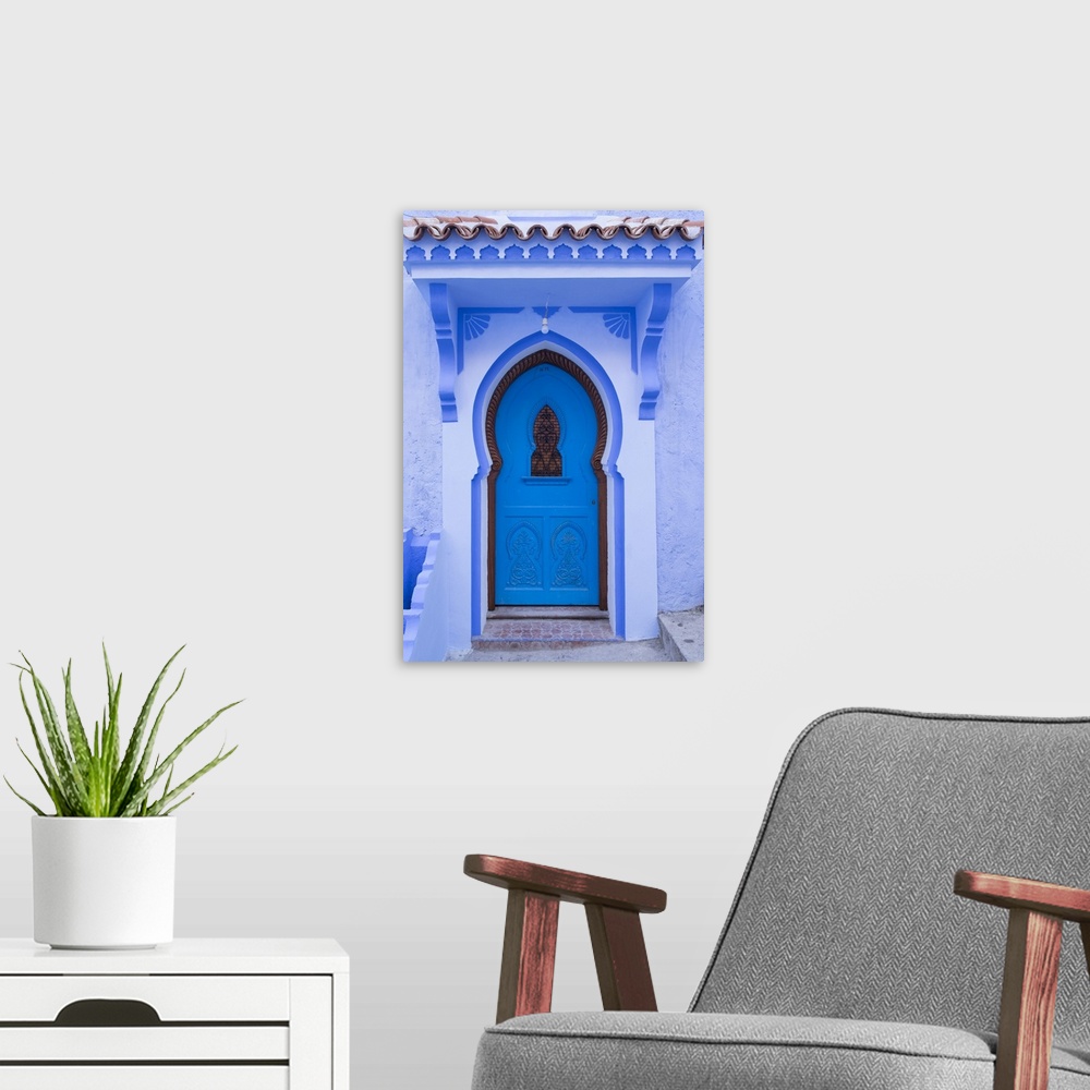 A modern room featuring Morocco, Chefchaouen. A traditional door and entrance to a home in the village.