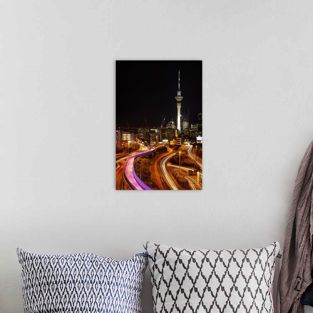 A bohemian room featuring Motorways, Light path cycleway, and sky tower at night, Auckland, North Island, New Zealand.