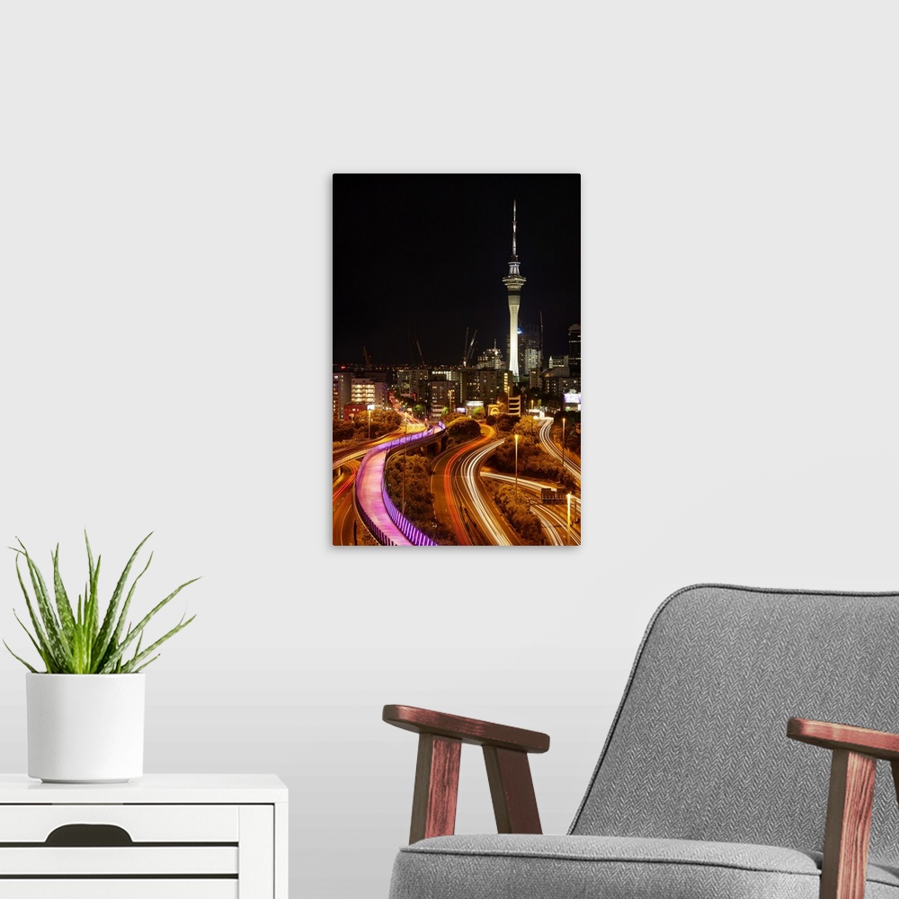A modern room featuring Motorways, Light path cycleway, and sky tower at night, Auckland, North Island, New Zealand.