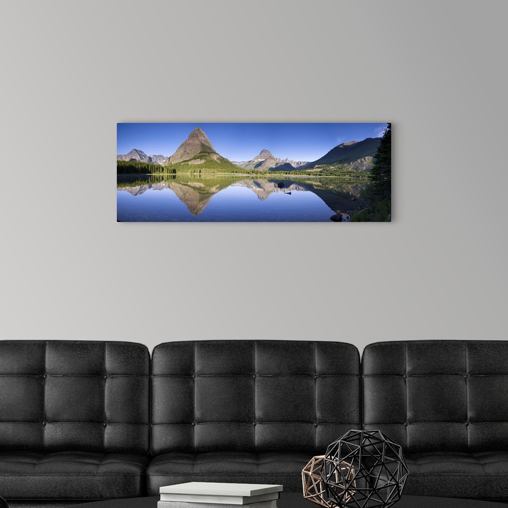 A modern room featuring Mountains reflected in Lake. Glacier National Park. Montana. USA.