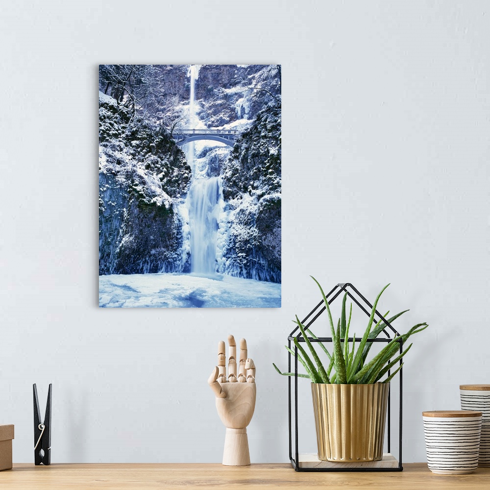 A bohemian room featuring Multnomah Falls with snow and ice, winter in Columbia River Gorge.