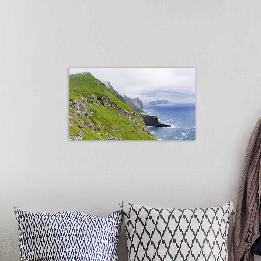 A bohemian room featuring The island Mykines,in the background the island Vagar, part of the Faroe Islands in the North Atl...