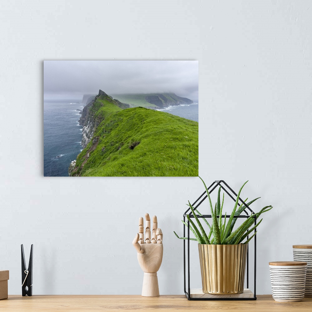 A bohemian room featuring The island Mykines, seen from Mykinesholmur, part of the Faroe Islands in the North Atlantic. Eur...