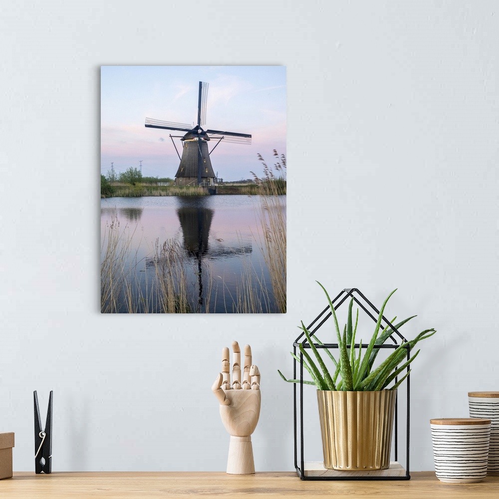 A bohemian room featuring Netherland, Kinderdijk. Windmills along the canal.