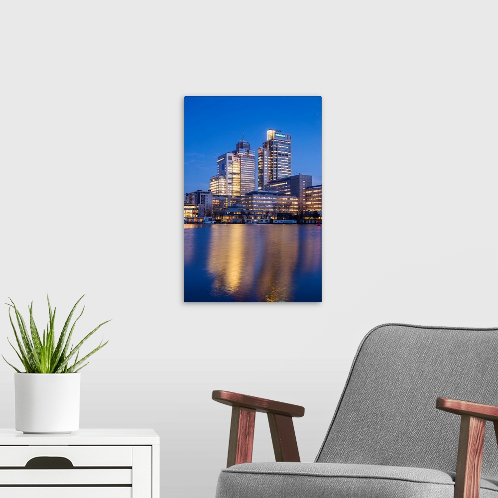 A modern room featuring Netherlands, Amsterdam, Omval Commercial District, office towers, dawn.