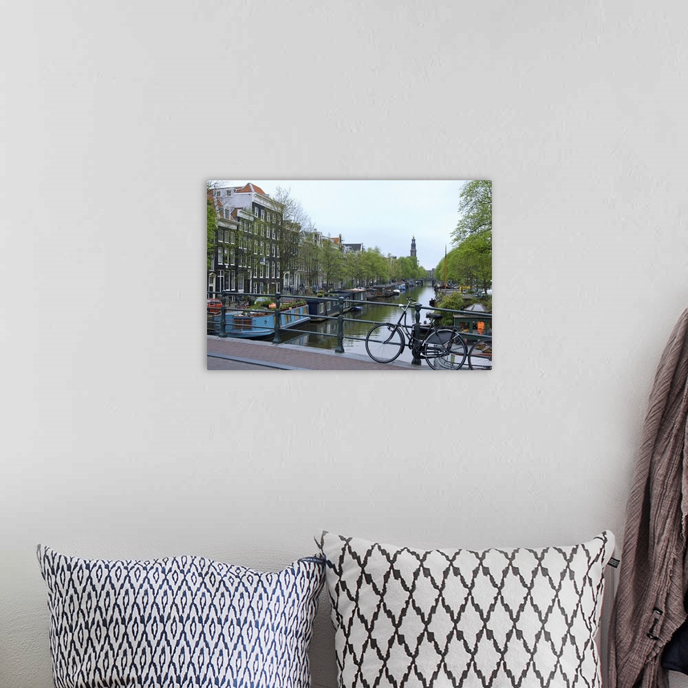 A bohemian room featuring Europe, Netherlands, Holland, Amsterdam, Along the Prinsengracht canal with the Westerkerk in the...