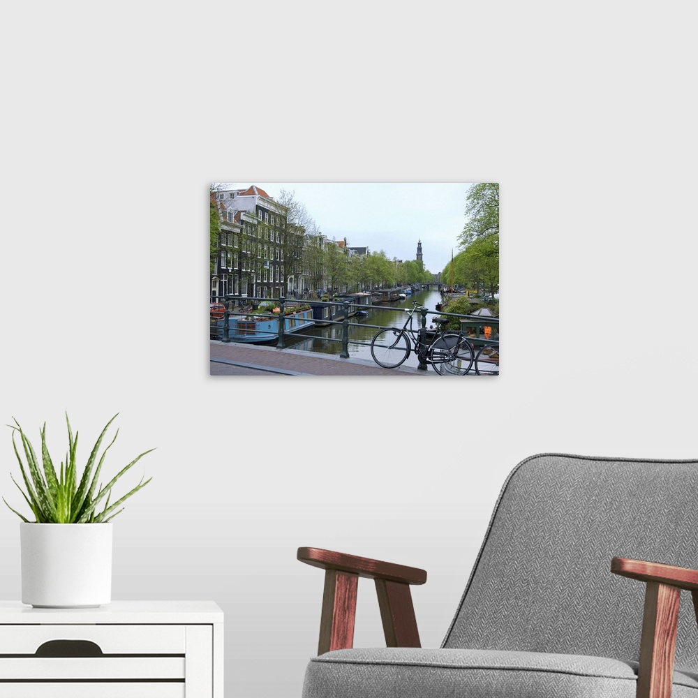 A modern room featuring Europe, Netherlands, Holland, Amsterdam, Along the Prinsengracht canal with the Westerkerk in the...