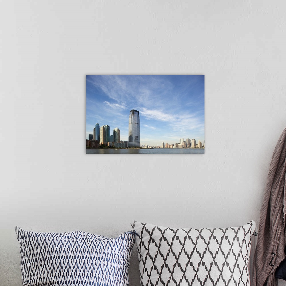A bohemian room featuring USA, New Jersey, Jersey City, Manhattan skyline rises above Hudson River across from rising skysc...