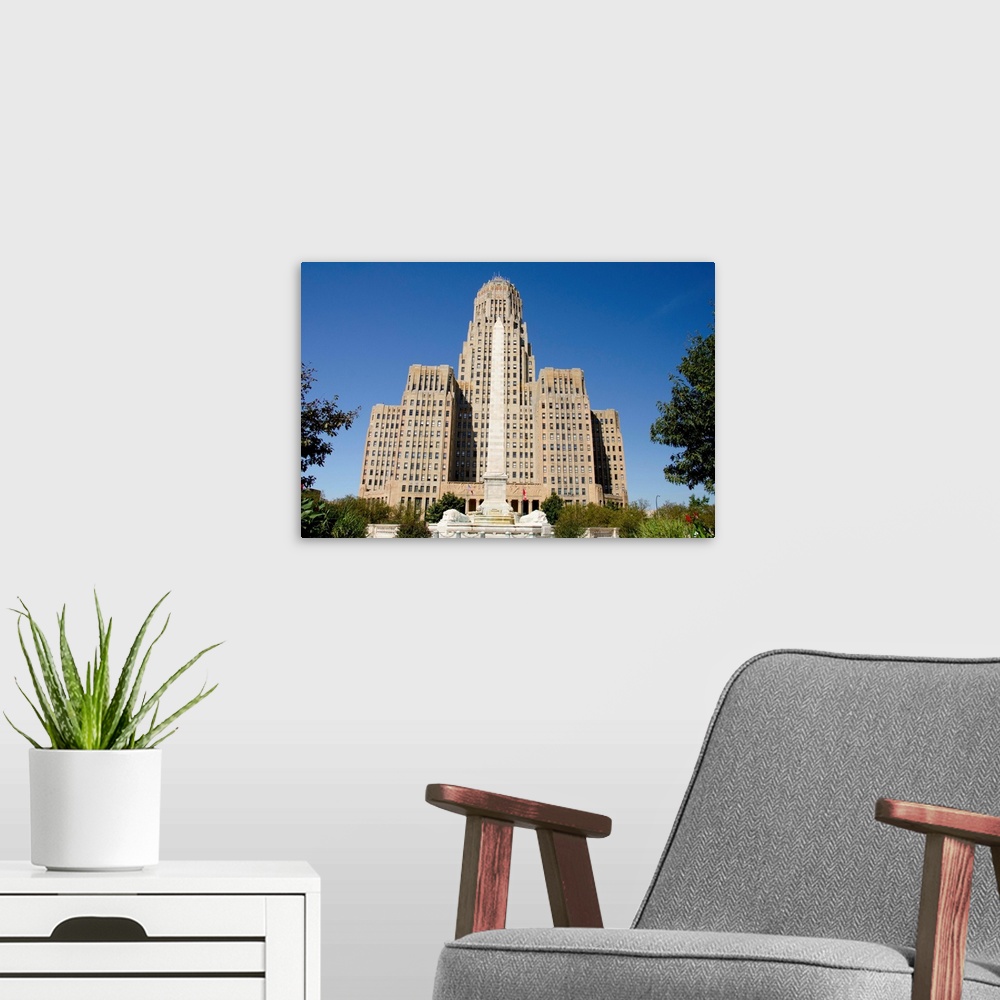 A modern room featuring New York, Buffalo. Historic art deco City Hall with the McKinley Monument fountain and obelisk.