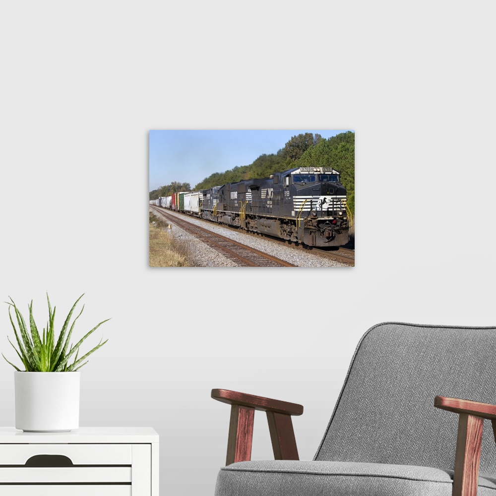 A modern room featuring Norfolk Southern Railway locomotive traveling along Highway 72 west of Mussel Shoals, Alabama, USA.