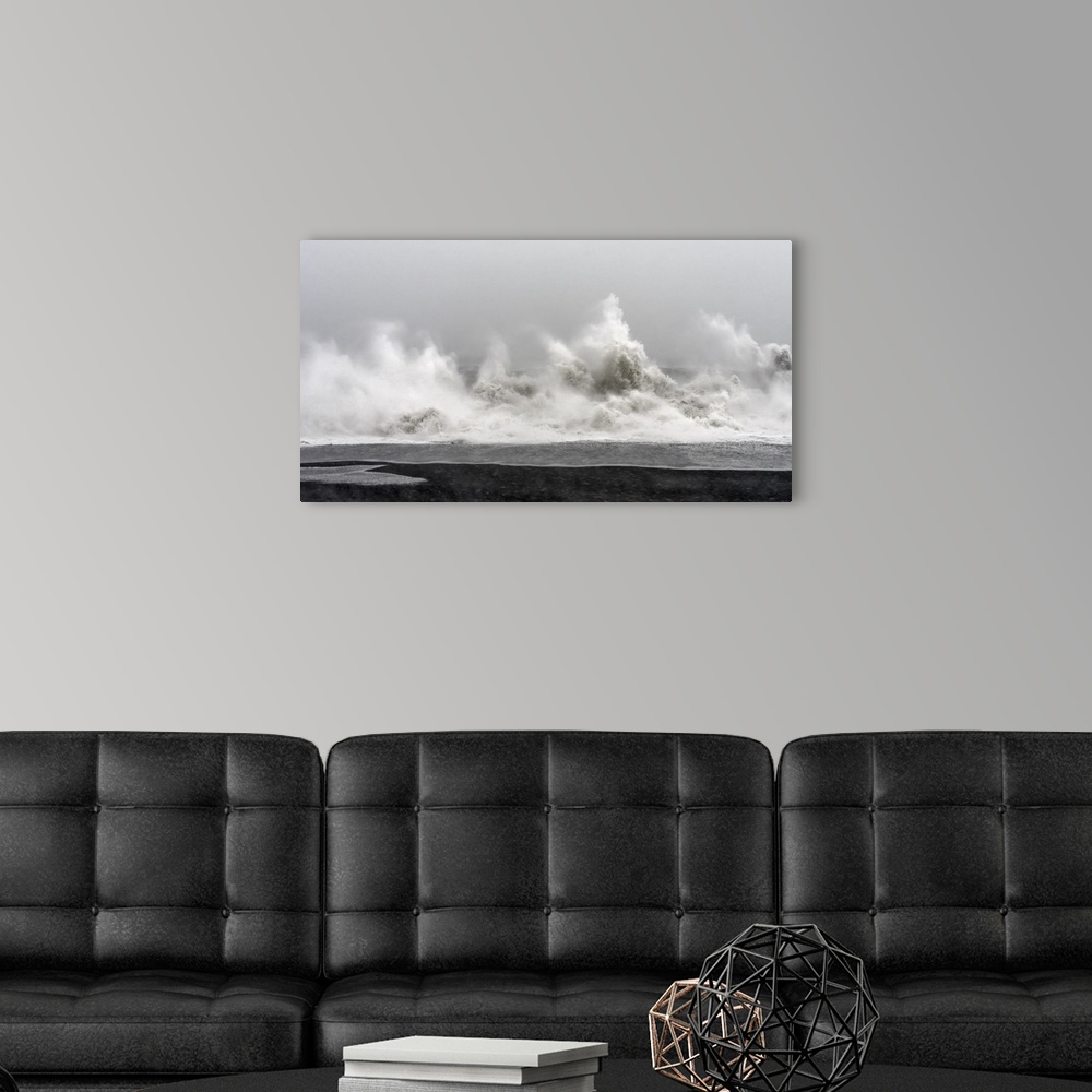 A modern room featuring North Atlantic coast near Vik y Myrdal during a winter storm with heavy gales. .