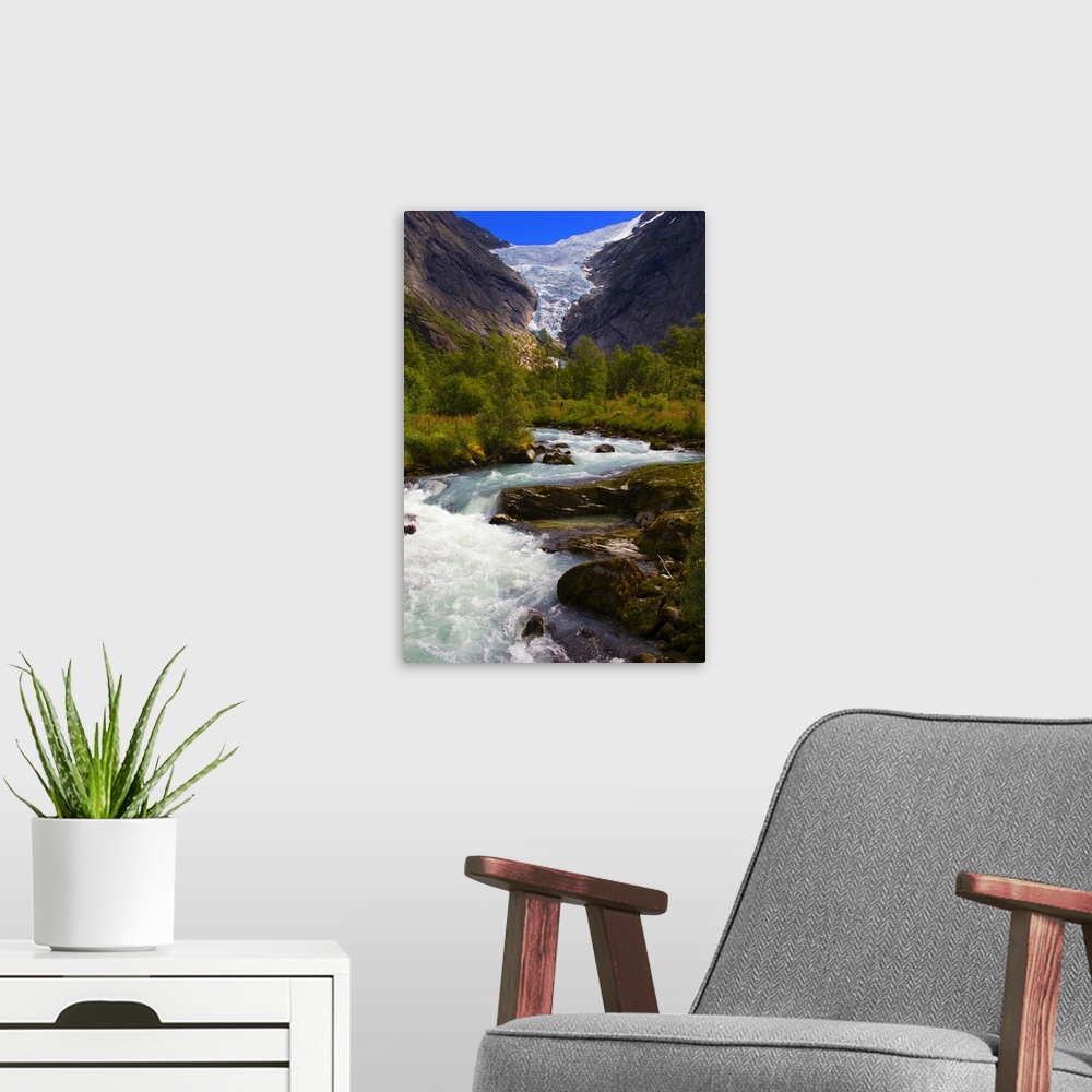 A modern room featuring Norway. Briksdal Glacier and River.