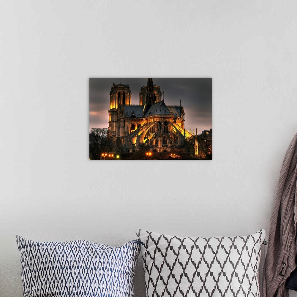 A bohemian room featuring Notre dame cathedral and the seine river shimmer in the Paris, France. Night.