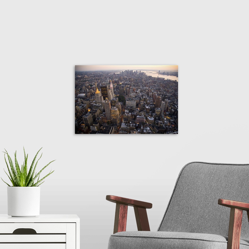 A modern room featuring New York Skyline from the Empire State Building, New York City, Manhattan, New York.