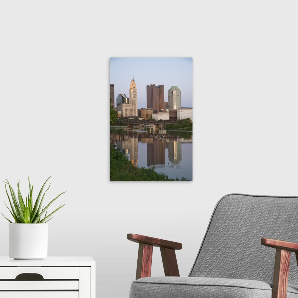 A modern room featuring USA, Ohio, Columbus: City skyline and the Scioto River.