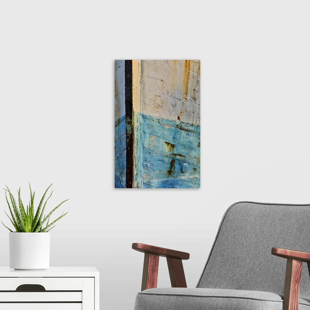 A modern room featuring Old wooden fishing boat out of water, detail of paint. Crescent City, California.