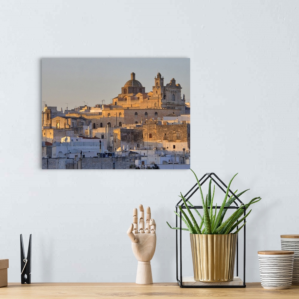 A bohemian room featuring The picturesque old town of Ostuni in southern Italy, built on top of a hill and crowned by its G...
