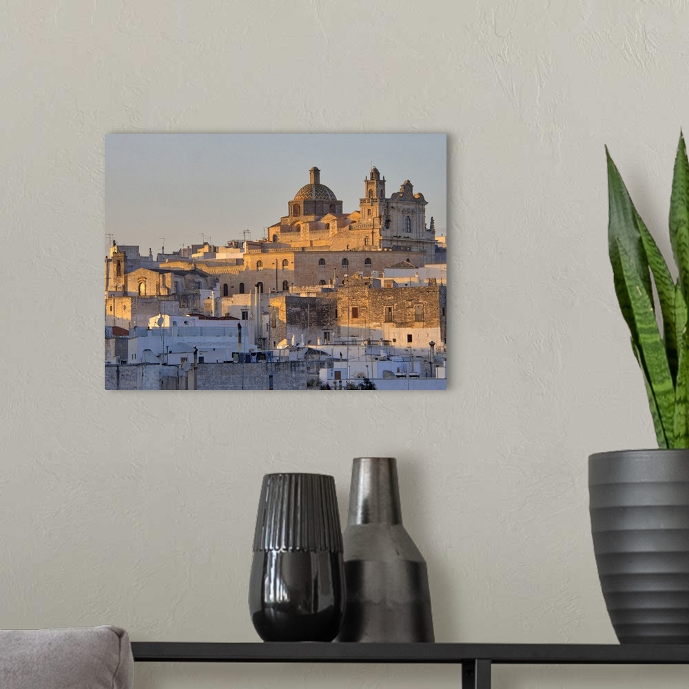 A modern room featuring The picturesque old town of Ostuni in southern Italy, built on top of a hill and crowned by its G...