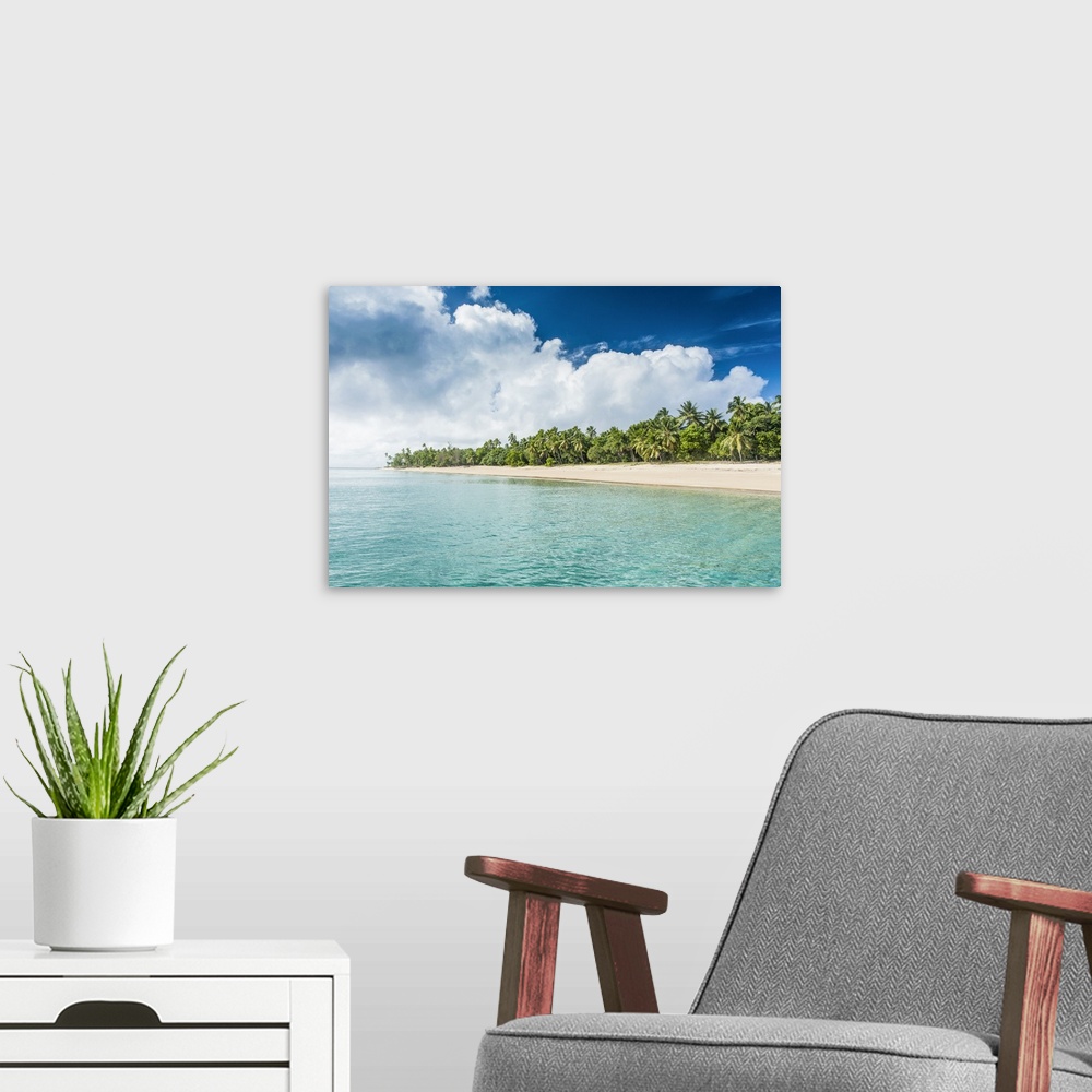 A modern room featuring Palm fringed white sand beach in Ha'apai, Ha'apai islands, Tonga, South Pacific.