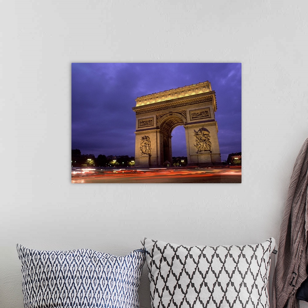 A bohemian room featuring Paris, France. Famous Arc de Triomphe Monument at Sunset.