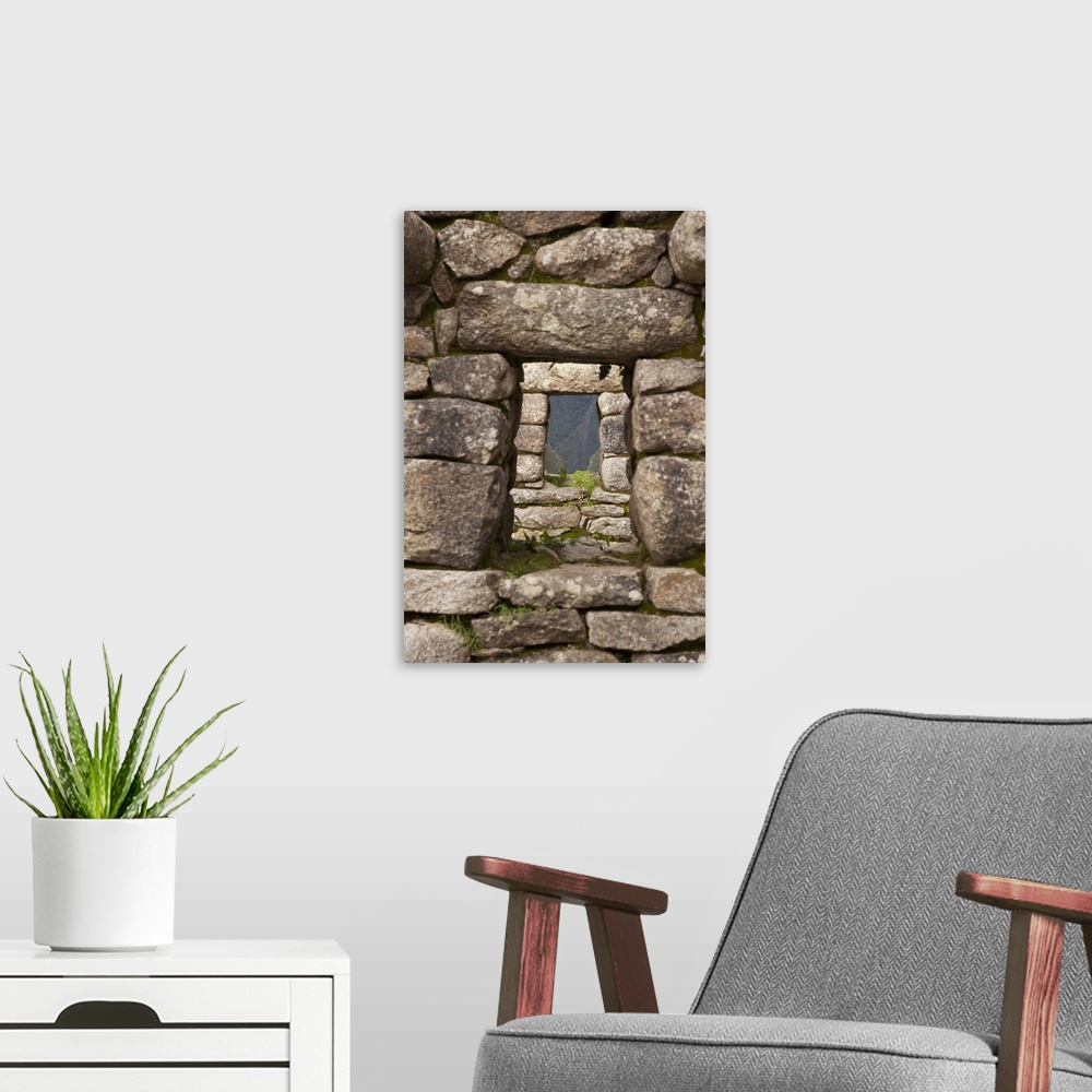 A modern room featuring South America, Peru, Machu Picchu. Aligned windows in stone house ruins. (UNESCO World Heritage S...