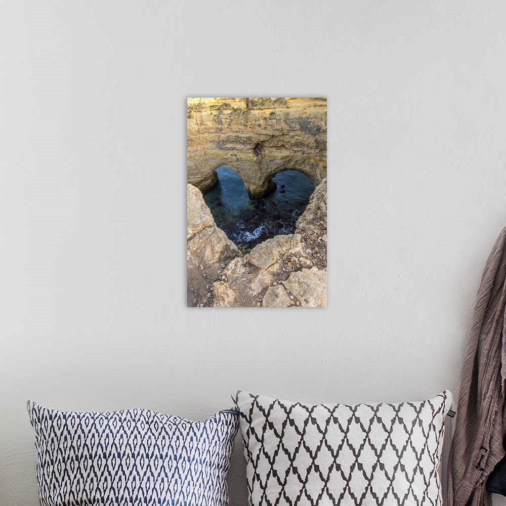A bohemian room featuring Portugal. Heart-shaped rock design on shore.